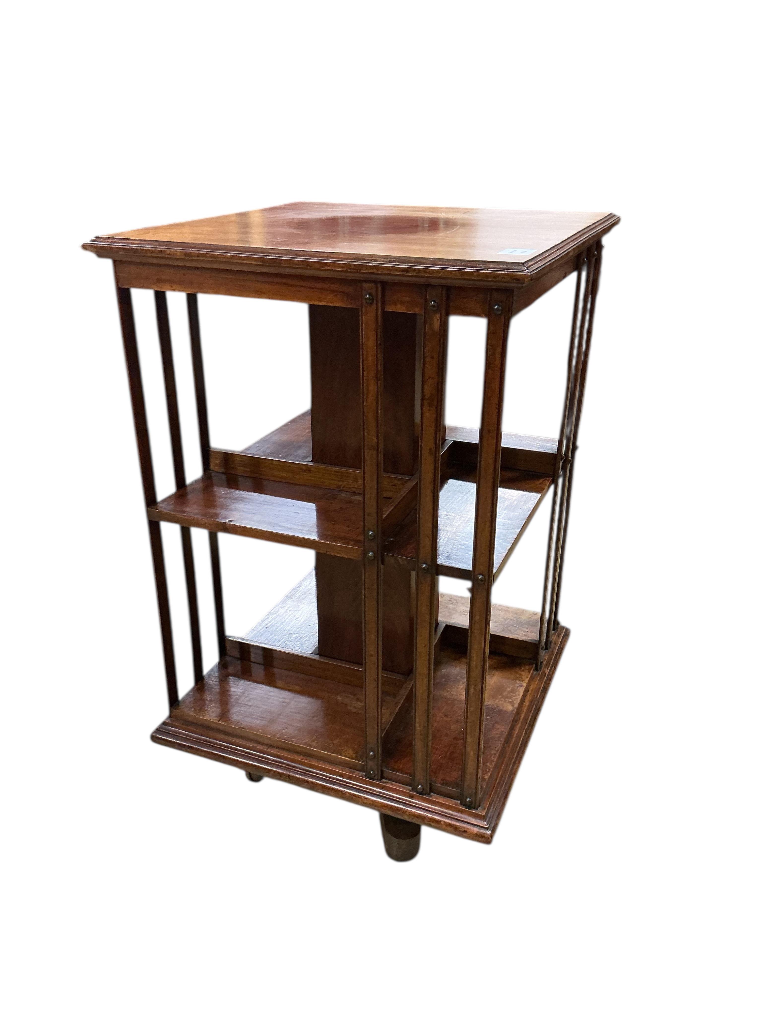 A late Victorian walnut revolving bookcase, width 52cm, depth 52cm, height 91cm